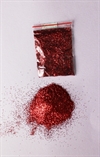 Glimmer / glitter i lille pose. Rød. Ca. 5 g.